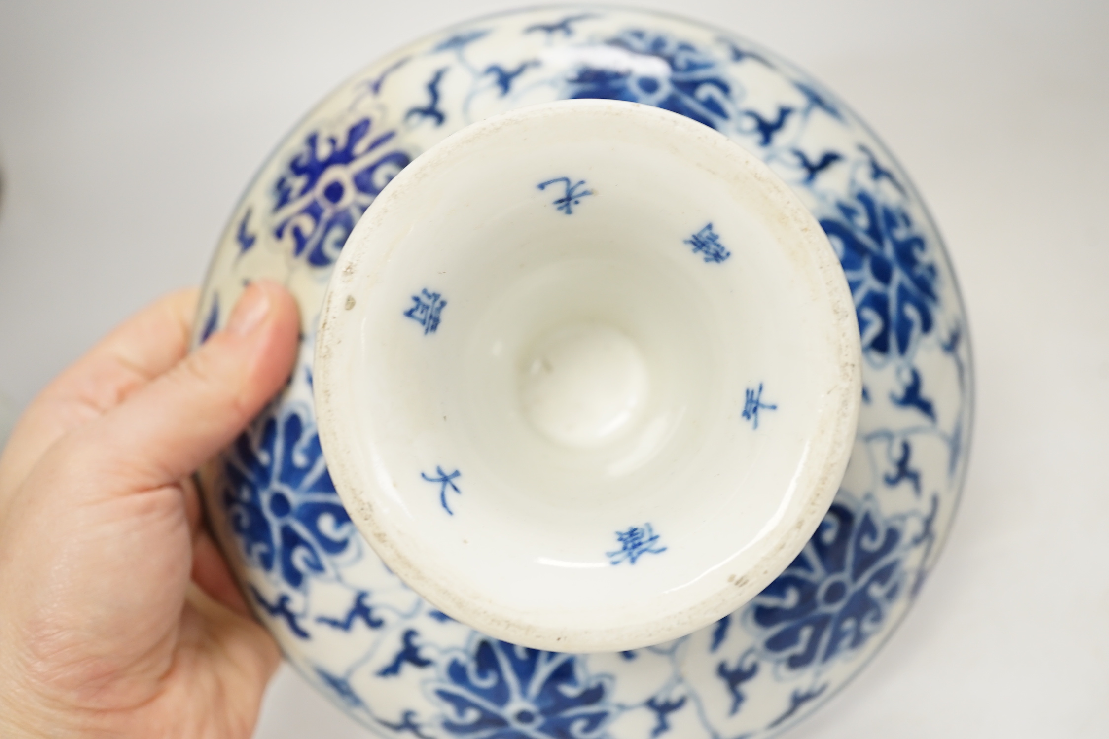 A Chinese underglaze copper red ‘herder and goats’ vase, Kangxi six character mark but Republic period and a Chinese blue and white lotus stem dish, six character Guangxu mark and period, both damaged